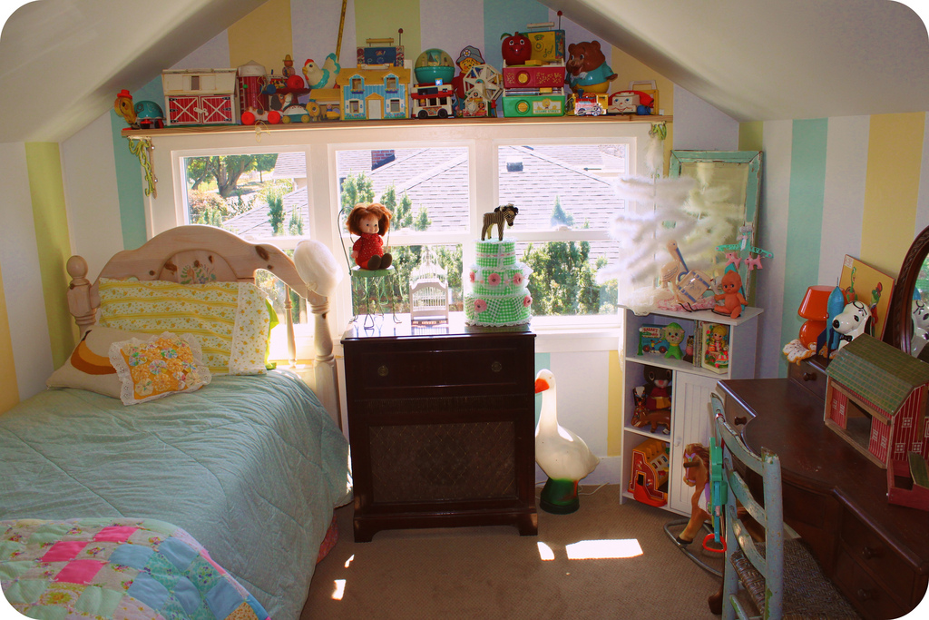 Child's bedroom full of toys and cute furniture