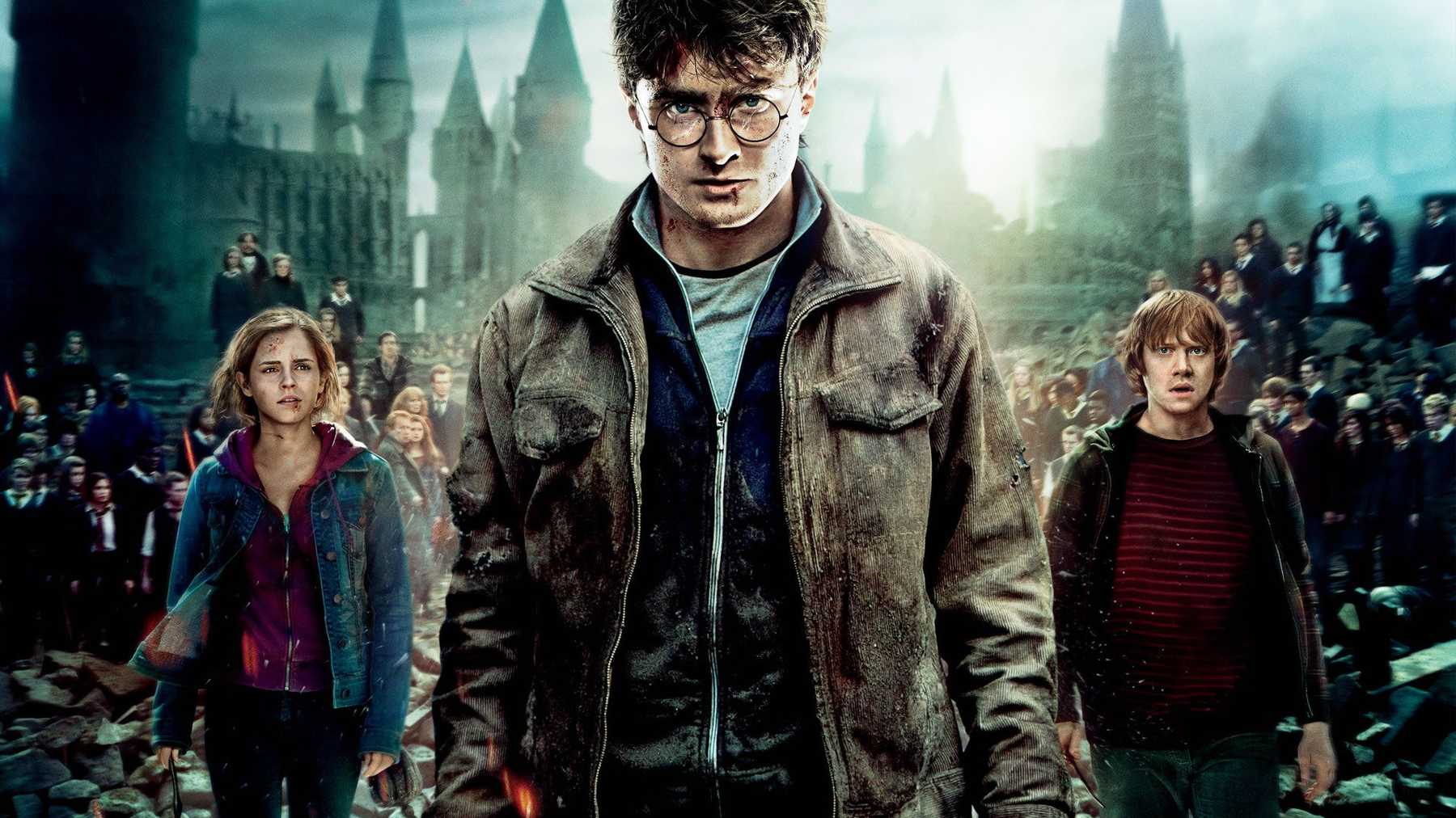 Harry, Ron and Hermione as young adults, wearing denim and leather, covered in grime and blood, leading a large group of students and teachers