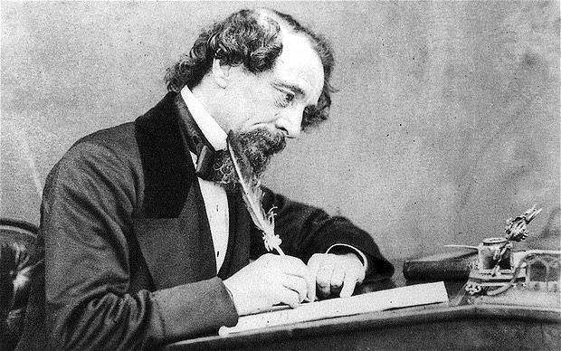 dickens at his desk